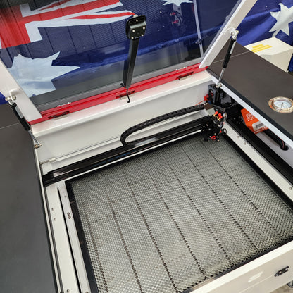 J750 Laser Machine 90-100W RECI T2 700x500mm showing the interior work area and design detail.