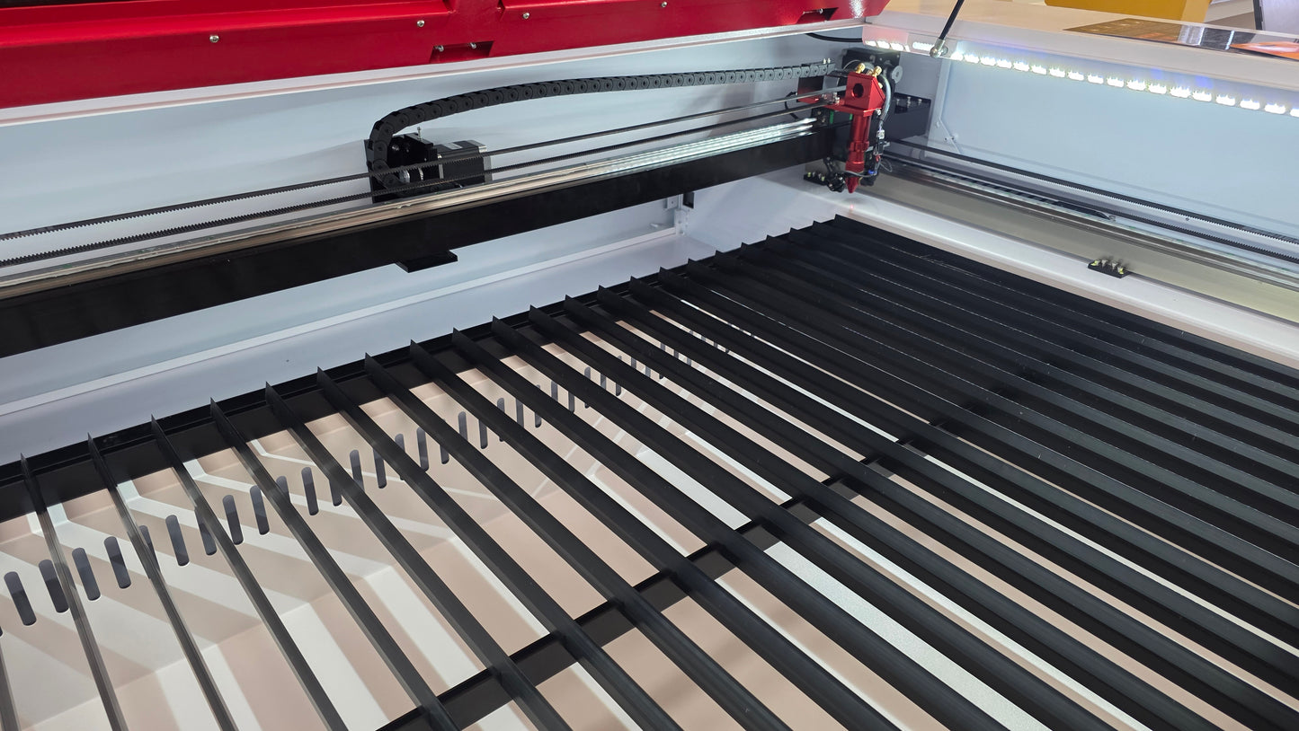 Interior view of R1390 Laser Machine RECI W4 showing the laser cutter mechanism and work area.