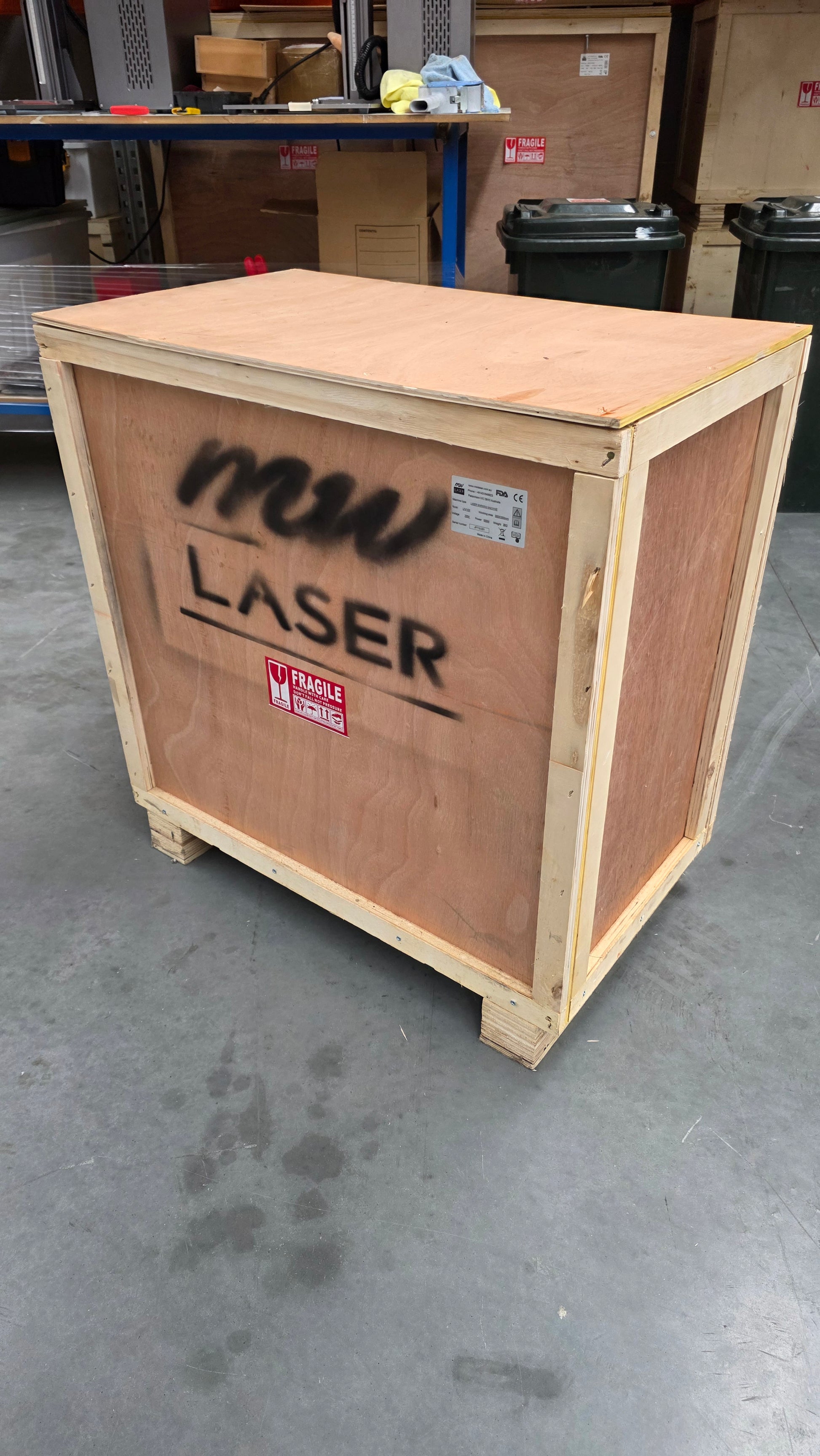 Wooden crate labeled with "MW LASER" for UV Laser Marking Machine shipment.