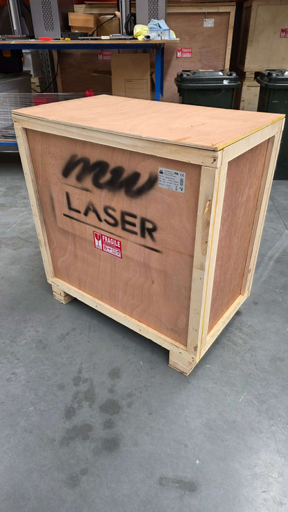 Wooden crate labeled with "MW LASER" for UV Laser Marking Machine shipment.