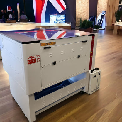 J750 Laser Machine 90-100W RECI T2 700x500mm showcased at an exhibition, highlighting its compact design and features.